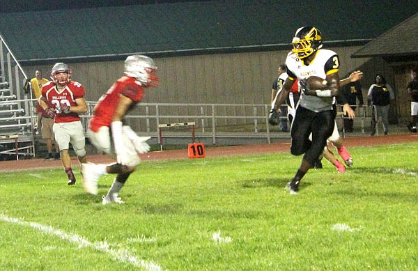 Fulton senior running back Nazir McClain seeks to break past a Mexico defender during a game earlier this month in Mexico.