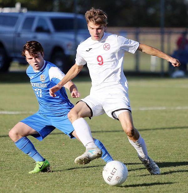 Joe Wilder of the Jefferson City Jays attempts to take possession of the ball from Peyton Browne of Rockhurst during Wednesday's game at the 179 Soccer Park.