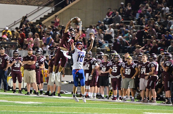 Dalton Depee of School of the Osage goes up to catch a pass against California's Liam Glenn during last Friday's game.