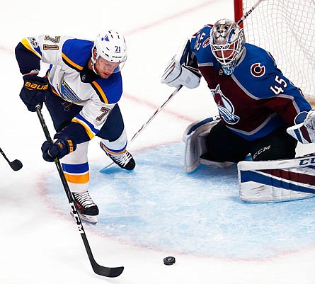 Vladimir Sobotka of the Blues directs the puck toward Avalanche goalie Jonathan Bernier during the third period Thursday night in Denver.