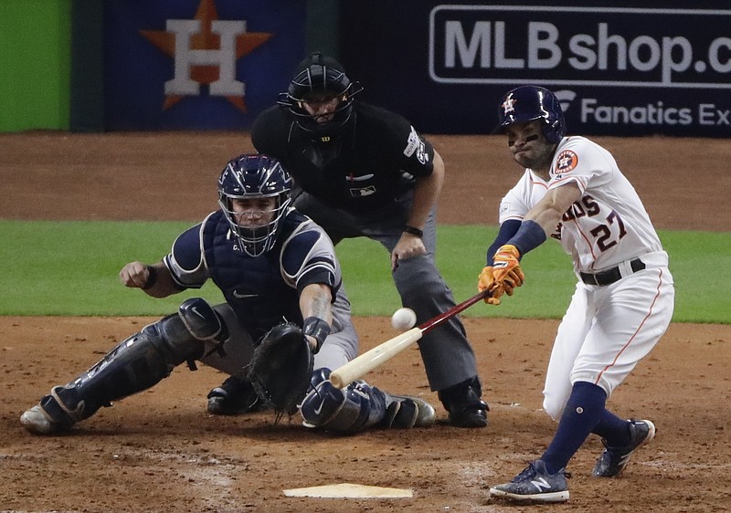 Houston Astros' Jose Altuve hits a home run during the eighth inning of Game 6 of baseball's American League Championship Series against the New York Yankees Friday, Oct. 20, 2017, in Houston.