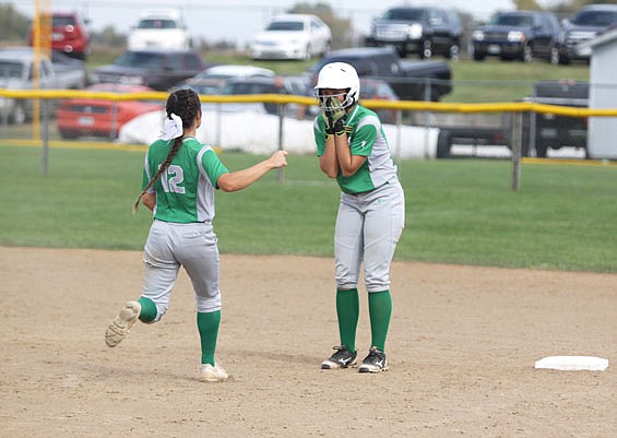 Kayla Jones (left) runs out to celebrate with Blair Oaks teammate Brooke Boessen after Boessen drove in the winning run with an single in Friday's 2-1 victory against Lathrop in the Class 2 semifinals at the Killian Sports Complex in Springfield.