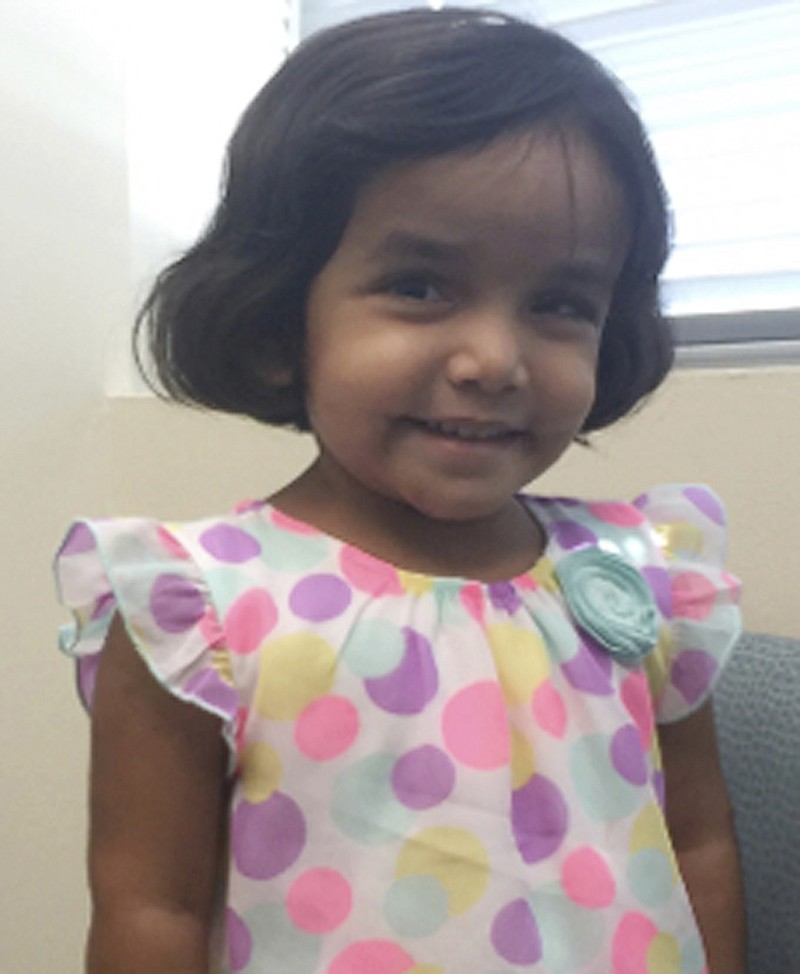 FILE- This undated photo provided by the Richardson Texas Police Department shows 3-year-old Sherin Mathews. Police in a Dallas suburb say they've found the body of a small child on Sunday, Oct. 22, 2017, not far from the home of Sherin Mathews, who's been missing since early this month. Her father, Wesley Mathews, has told authorities he ordered the child to stand next to a tree behind the fence at their home around 3 a.m. on Oct. 7 as punishment for not drinking her milk and she went missing. Police say the body hasn't been positively identified. (Richardson Texas Police Department via AP)