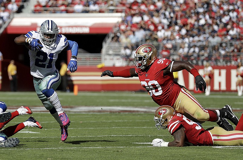 Dallas Cowboys running back Ezekiel Elliott (21) runs against the San Francisco 49ers during the first half of an NFL football game Sunday in Santa Clara, Calif.