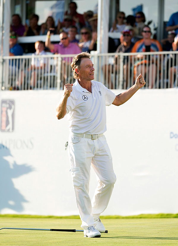 Bernhard Langer celebrates his tournament winning eagle putt in the 18th hole Sunday during the final day of the PGA Champions Tour's Dominion Energy Charity Classic  in Henrico, Va.