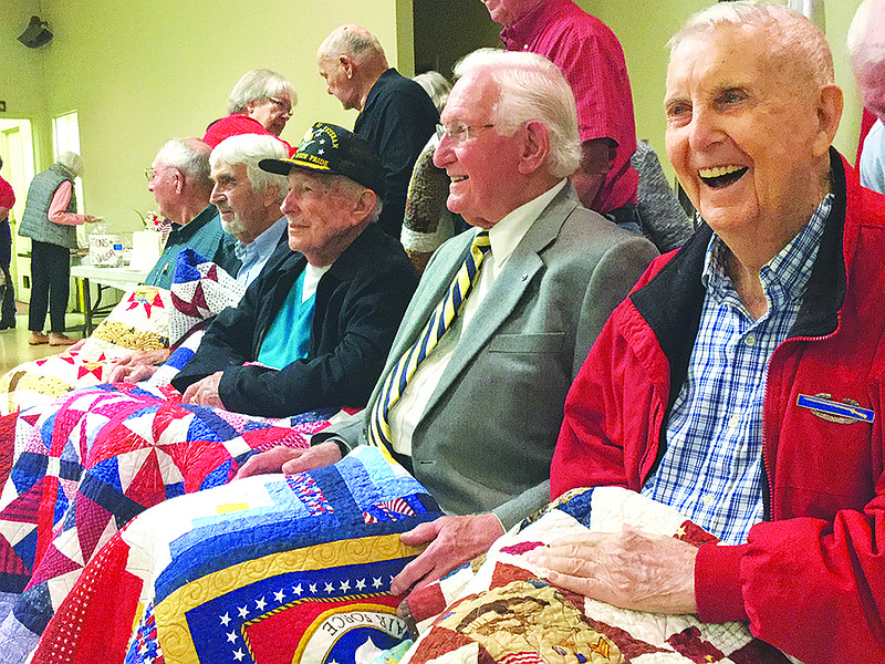 Honorees at a Sunday "Quilts of Valor" ceremony at American Legion Post 5 relax before posing for photos after the ceremony. Pictured, from right, are Everette Goyd, Nicholas Monaco, Donald O'Connor, Charles Palmer and Paul LePage.