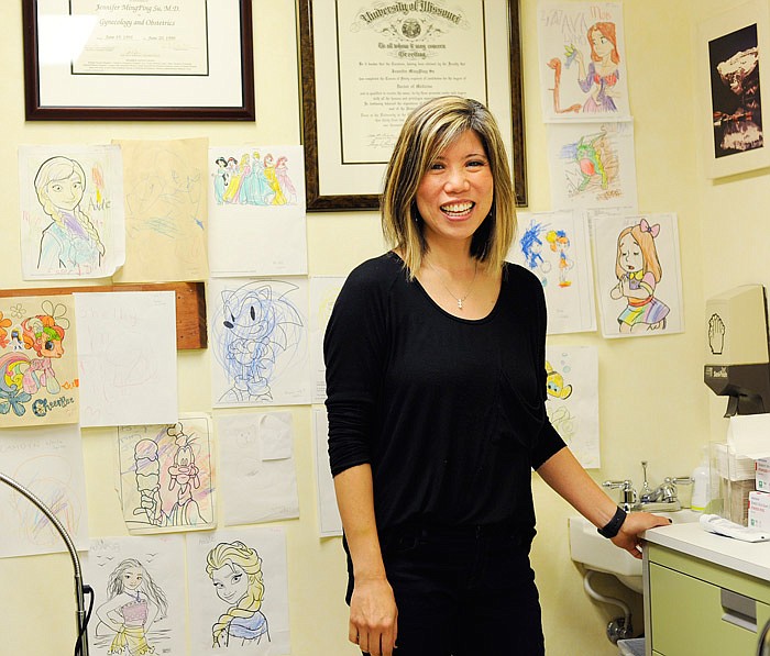 Area ob-gyn Dr. Jennifer Su displays artwork patients' children have made in rooms around her practice.