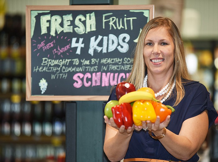 Ashley Varner, healthy communities coordinator for Capital Region Medical Center's Healthy Schools, Healthy Communities program, works to get area residents healthy by eating right, exercising and drinking plenty of water.