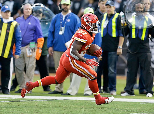 Chiefs rookie running back Kareem Hunt runs during last Thursday night's game against the Raiders in Oakland, Calif.