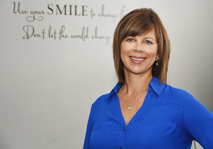 Dr. Nathalie Tungesvik poses at her Jefferson City dentistry office, Diamond Ridge Dentistry.