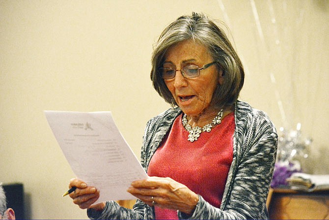 Carolyn Saucier reads from a list of possible measures that could be taken to reduce racial prejudices in the community at a Faith Voices for Jefferson City gathering Monday at Quinn Chapel A.M.E. Church. 