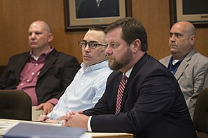 Billy Joel Tracy, center and wearing glasses, is shown in the first day of his capital murder trial on Monday. Tracy is accused of beating a Telford prison guard to death in 2015. Tracy was an inmate in the New Boston, Texas, prison at the time. The trial is expected to resume Wednesday. 
