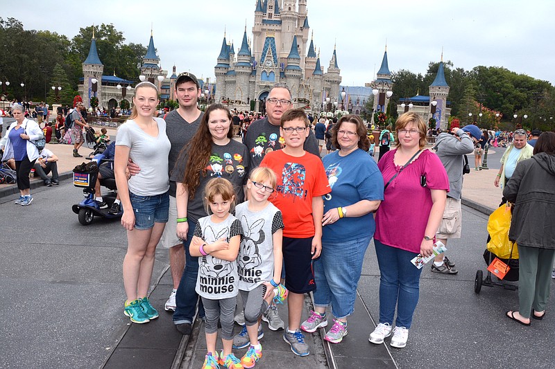 The Figgins family has grown through foster care and adoption. Pictured here are Anastasia Hansen, Don Figgins, Casey Figgins, Bill Figgins, Cathy Figgins and Katie Figgins. In the front are Amber Figgins, Brooklynn Figgins and Skip Figgins. (Submitted photo)