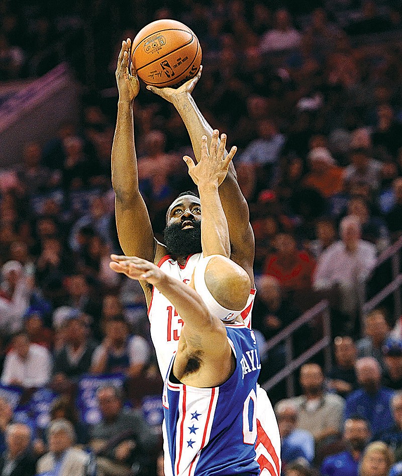 Houston Rockets' James Harden takes a shot over Philadelphia 76ers' Jerryd Bayless in the first half Wednesday in Philadelphia. 