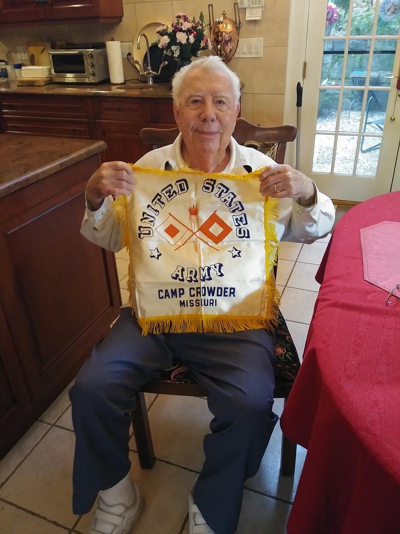 Mort Walker is pictured with a vintage "Sweetheart Pillow" sold in the post exchanges at Camp Crowder during WWII. The camp became the inspiration for the fictional "Camp Swampy" in his "Beetle Bailey" comic strip. (Courtesy of Jeremy P. Amick)