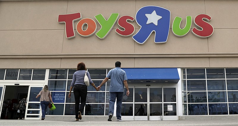 FLE - In this Sept. 19, 2017, photo, shoppers walk into a Toys R Us store, in San Antonio. There’s trouble in toyland, and companies are blaming Toys R Us. Mattel, the maker of Barbie dolls and Hot Wheels cars, reported disappointing third-quarter results late Thursday, Oct. 26 and said it was hurt by Toys R Us’ Chapter 11 bankruptcy filing last month. Hasbro, the maker of My Little Pony and Monopoly, had also blamed weak results on the Toys R Us situation.  (AP Photo/Eric Gay, File)