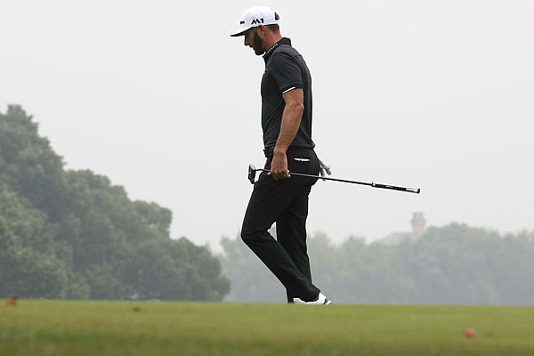 Dustin Johnson walks on the green during Sunday's final round of the WGC-HSBC Champions tournament at the Sheshan International Golf Club in Shanghai, China.