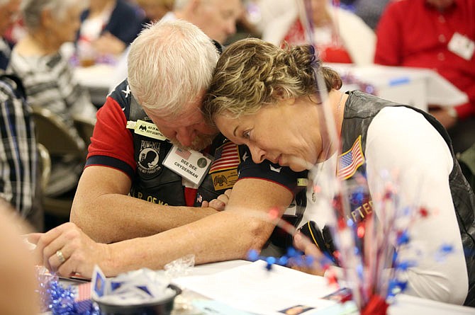  Donald and Dee Dee Cryderman embrace during a prayer Thursday at Operation Bugle Boy's Veterans Appreciation Night at the St. Martins Knights of Columbus.
