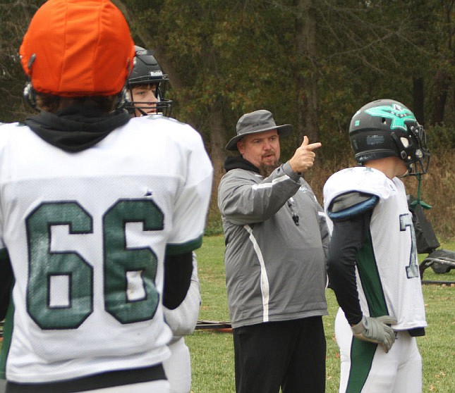 North Callaway head coach Kevin O'Neal goes over blocking schemes with the Thunderbirds' offensive line
during Tuesday afternoon's practice in Kingdom City.