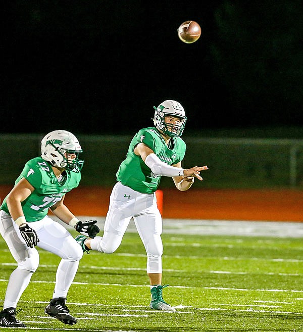 Blair Oaks quarterback Nolan Hair fires a pass downfield during Friday night's Class 3 District 6 championship game against Mexico at the Falcon Athletic Complex in Wardsville.