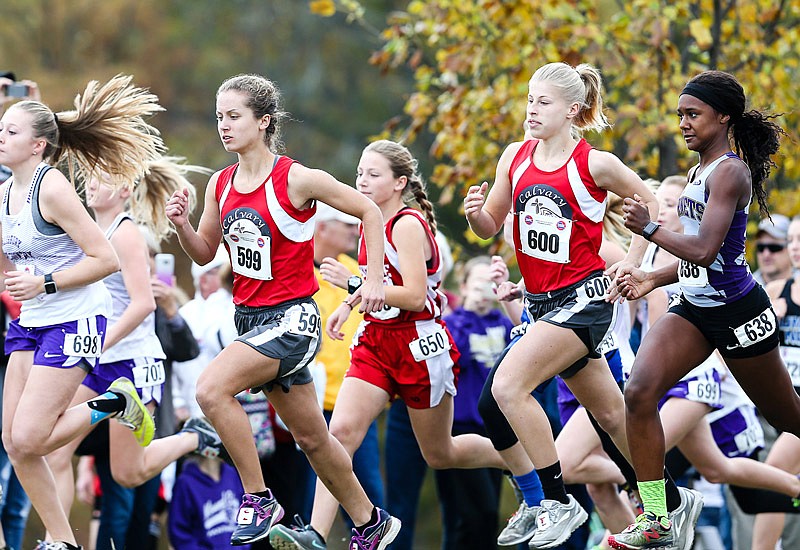 Calvary Lutheran teammates Emma Homfeldt (left) and Sarah Johnson (right) try to
keep pace with the pack early in the Class 1 race Saturday, Nov. 4, 2017 at the state cross country
championships at the Oak Hills Golf Center in Jefferson City.