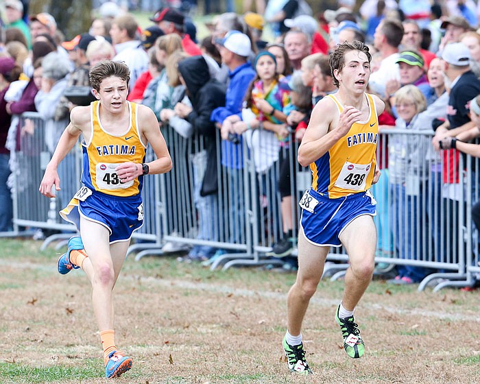 Fatima team mates Dawson Woehr (left) and Dylan Smith eye the finish line at the MSHSAA State Cross Country Championships at Oak Hills Golf Course in Jefferson City on Saturday, Nov. 4, 2017. 