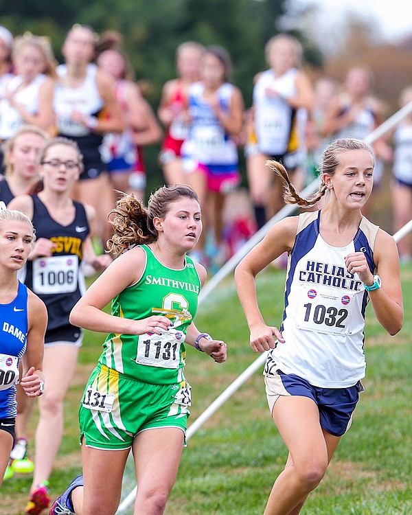 Abby Hake of Helias leads a pack of runners Saturday, Nov. 4, 2017 in the Class 3 girls cross country championships at the Oak Hills Golf Center in Jefferson City.