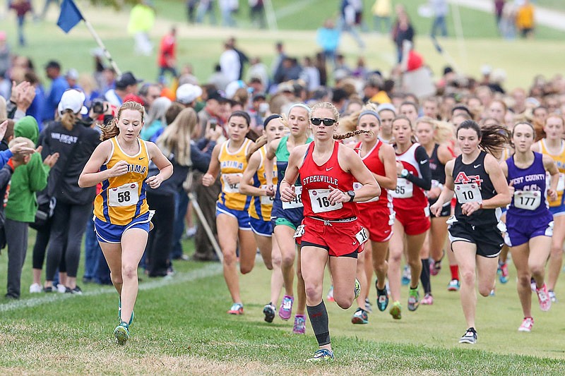 Brianna Haller of Fatima (far left) leads the pack on the opening part of the Class 2 girls cross country
championships Saturday morning, Nov. 4, 2017 at the Oak Hills Golf Center in Jefferson City.