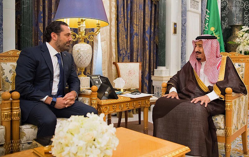 In this photo provided by the Saudi Press Agency, Saudi King Salman, right, meets with outgoing Lebanese Prime Minister Saad Hariri in Riyadh, Saudi Arabia, Monday, Nov. 6, 2017. Hariri's resignation in a televised statement from Saudi Arabia on Saturday stunned Lebanon and plunged the tiny nation into uncertainty. In his resignation, Hariri accused Shiite power Iran of meddling in Arab affairs and the Iran-backed Lebanese militant Hezbollah group of holding Lebanon hostage. (Saudi Press Agency, via AP)