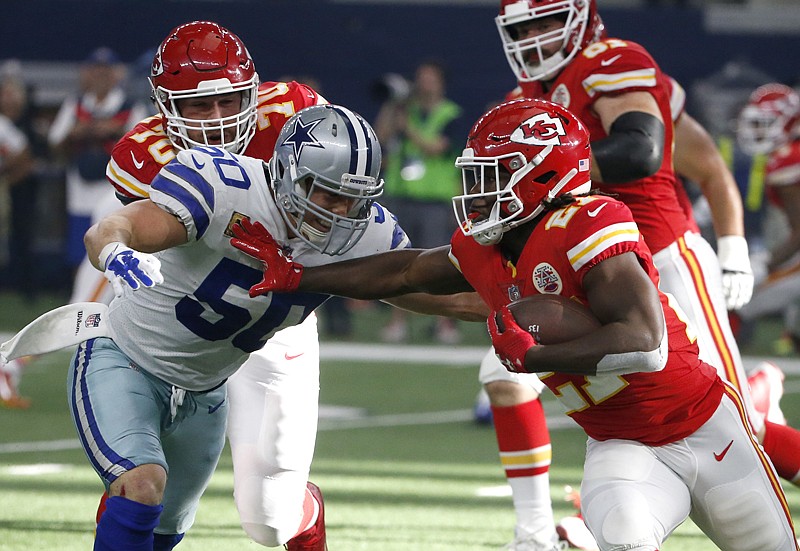 Dallas Cowboys linebacker Sean Lee (50) attempts to stop Kansas City Chiefs running back Kareem Hunt (27) in the first half of an NFL football game Sunday in Arlington, Texas.