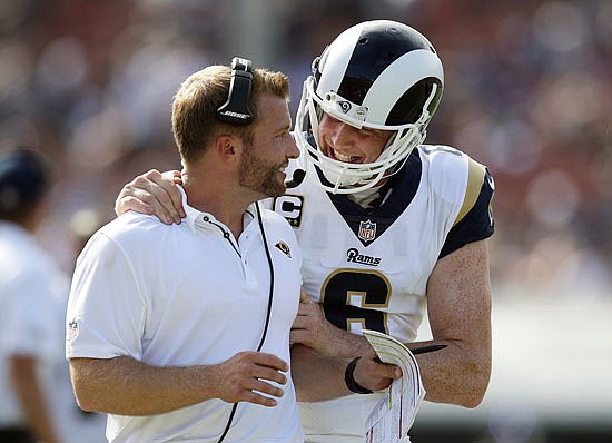 Rams head coach Sean McVay talks with punter Johnny Hekker after Hekker threw a pass for a first down in a game this season against the Colts in Los Angeles.