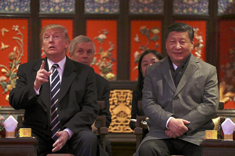 President Donald Trump, left, and Chinese President Xi Jinping, right, arrive for opera performance at the Forbidden City, Wednesday, Nov. 8, 2017, in Beijing, China. Trump is on a five country trip through Asia traveling to Japan, South Korea, China, Vietnam and the Philippines. (AP Photo/Andrew Harnik)