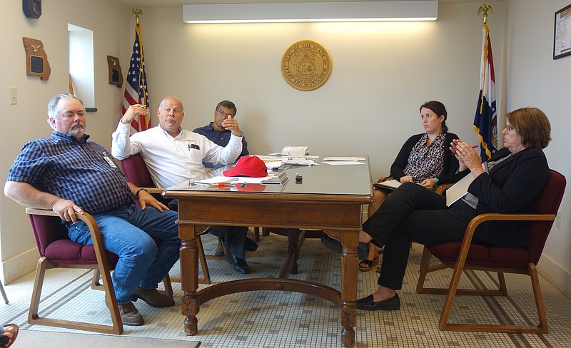 <p>Helen Wilbers/For the News Tribune</p><p>In June, Callaway County commissioners Randy Kleindienst, left, Gary Jungermann and Roger Fischer met with Boone County Court Administrator Mary Epping and Judge Sue Crane, among others, to discuss solutions for the county’s rapidly depleting Juvenile Justice Center care budget.</p>