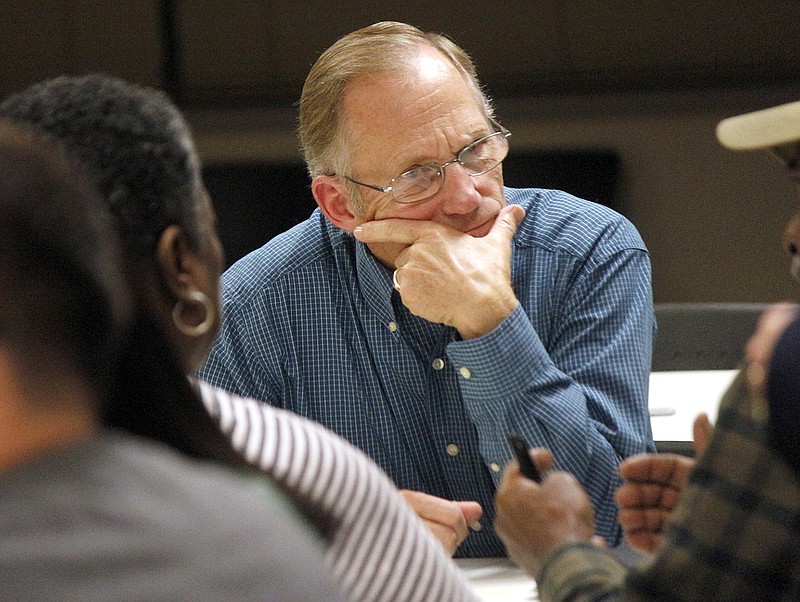 Eugene Vogel listens intently to a community member about their thoughts on the role of schools when it comes to the topic of diversity Tuesday during the Jefferson City Public Schools' Diversity Discussion in the Hawthorn Bank Community Room. Attendees gathered in groups of six at each table to discuss their viewpoints on diversity in the community.