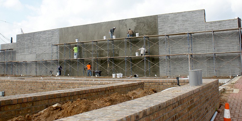 Workers are finishing with the addition of stucco to the walls of the downtown site on West Hiram that will bring additional parking as well as a gathering space for the public. The project should be completed in December.