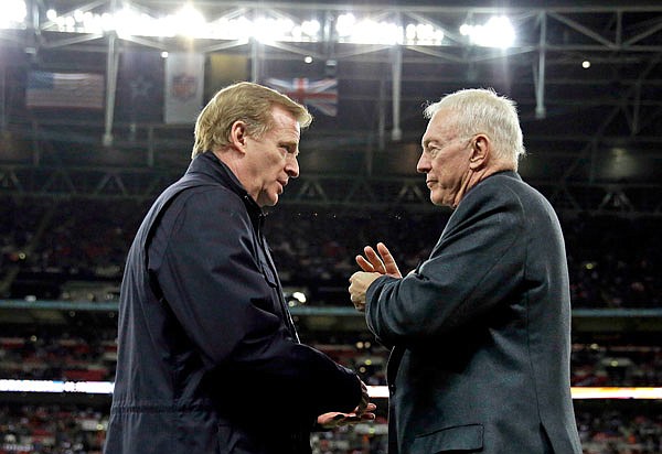 In this Nov. 9, 2014, file photo, NFL commissioner Roger Goodell (left) and Cowboys owner Jerry Jones talk during a game between the Jaguars and Cowboys at Wembley Stadium in London.