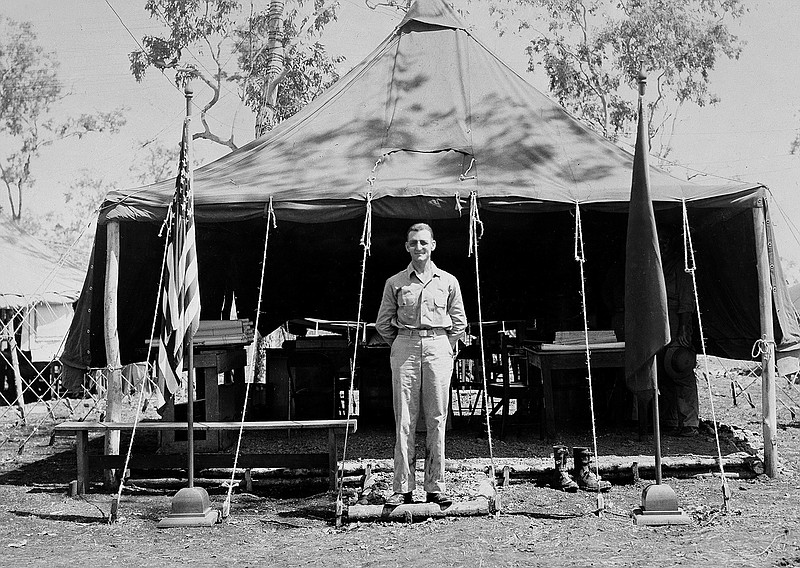 In this undated photo provided by the U.S. Air Force, Brig. Gen. Kenneth N. Walker, commanding general of a bomber command in the Southwest Pacific, poses for a photo in front of his tent-office in the field. Nearly 75 years after his father disappeared during a bombing mission over a remote Pacific island, Douglas Walker, the son of the highest-ranking recipient of the Medal of Honor still listed as missing from World War II, is pushing for renewed interest in finding the crash site and the remains of the crew. 
