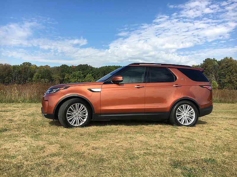 The fifth-generation 2017 Land Rover Discovery in Namib Orange is a luxury three-row SUV powered by a V-6 diesel engine with all sorts of technological conveniences that help define luxury. (Robert Duffer/Chicago Tribune/TNS)