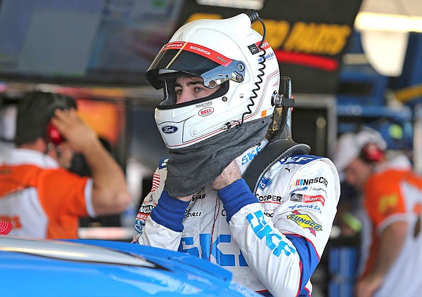Ryan Blaney adjust his helmet before practice Friday for the NASCAR Cup Series race at Phoenix International Raceway in Avondale, Ariz. Blaney will start from the pole today.