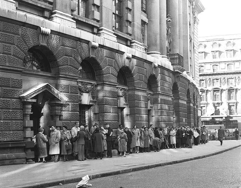 FILE - In this B/W file photo dated Oct. 27, 1960,  a queue forms outside The Old Bailey Central Criminal Court, in London, for admission to the public gallery where the "Lady Chatterley's Lover" case is resuming.  The towering legal figure who helped liberalize British laws around sex and freedom of expression, successfully defending Penguin Books against obscenity charges for publishing D.H. Lawrence's novel "Lady Chatterley's Lover", the lawyer Jeremy Hutchinson died Monday Nov. 13, 2017, aged 102. (AP Photo, FILE)