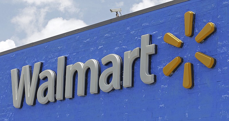 FILE - This Thursday, June 1, 2017, file photo, shows a Walmart sign at a store in Hialeah Gardens, Fla. Walmart announced Monday, Nov. 13, 2017, that it will devote a section on its website to upscale Lord & Taylor, the latest strategic partnership as retailers make alliances. (AP Photo/Alan Diaz, File)