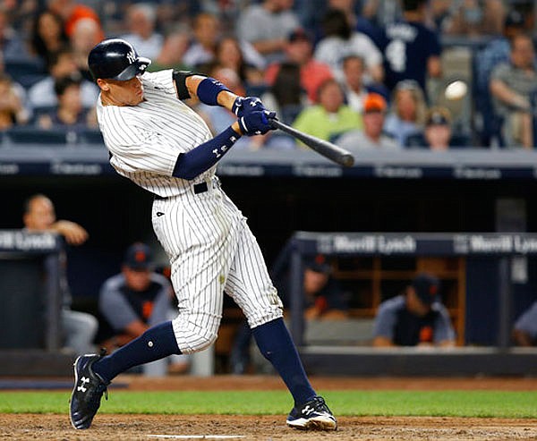 In this July 31 file photo, Yankees right fielder Aaron Judge hits a solo home run during the fifth inning of a game against the Tigers at Yankee Stadium in New York.