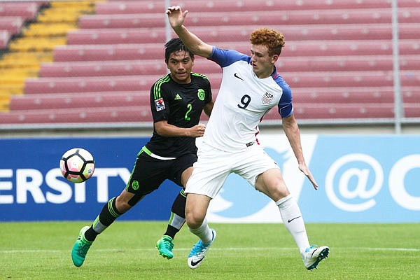 In this May 7 file photo, United States' Josh Sargent (right) and Mexico's Adrian Vazquez fight for the ball during the CONCACAF under-17 championship final in Panama City, Panama.