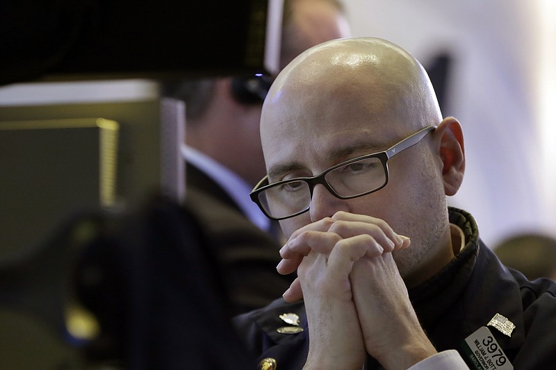 Specialist Mario Picone works at his post on the floor of the New York Stock Exchange, Wednesday, Nov. 15, 2017. U.S. stocks declined in early trading Wednesday as investors weighed a batch of economic data and company earnings. (AP Photo/Richard Drew)