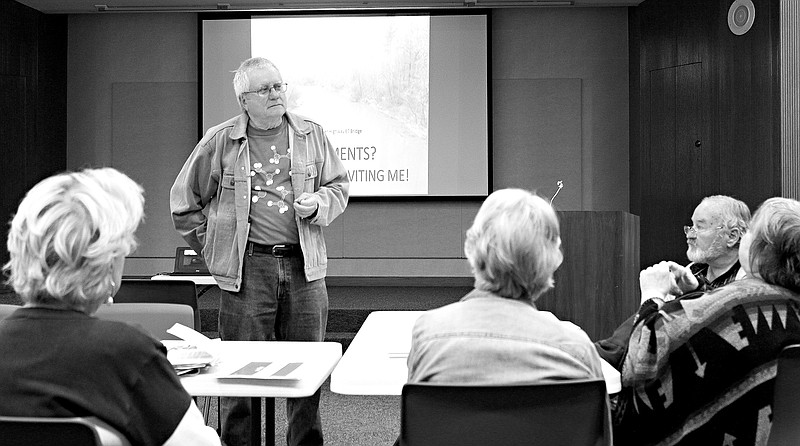 Dr. Mike Buttrem, sedimentation and water quality specialist for the Sulphur River Basin Authority, speaks at Tuesday's meeting of Friends United for a Safe Environment. Buttrem explained how the straightening of a portion of the Sulphur River contributes to sedimentation in Wright Patman Lake.