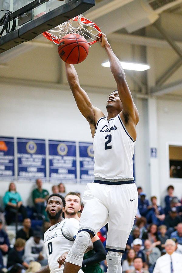 Terrance Smith of Lincoln slams home a dunk during Tuesday night's game against Missouri S&T at Jason Gym.