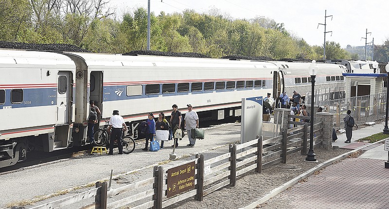 Passengers board an Amtrak train in November 2016 at the Jefferson Street depot. For the period of July through October, the River Runner route has seen a nearly 5 percent increase in ridership.