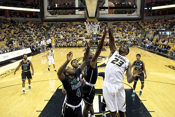 Missouri's Jeremiah Tilmon (right) heads to the basket during the first half of Monday night's game against Wagner at Mizzou Arena in Columbia.
