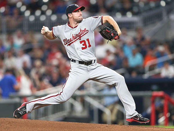 In this Sept. 19 file photo, Nationals pitcher Max Scherzer delivers to the plate against the Braves in the first inning of a game in Atlanta. Scherzer, a former Missouri pitcher, won his third career Cy Young Award on Wednesday.