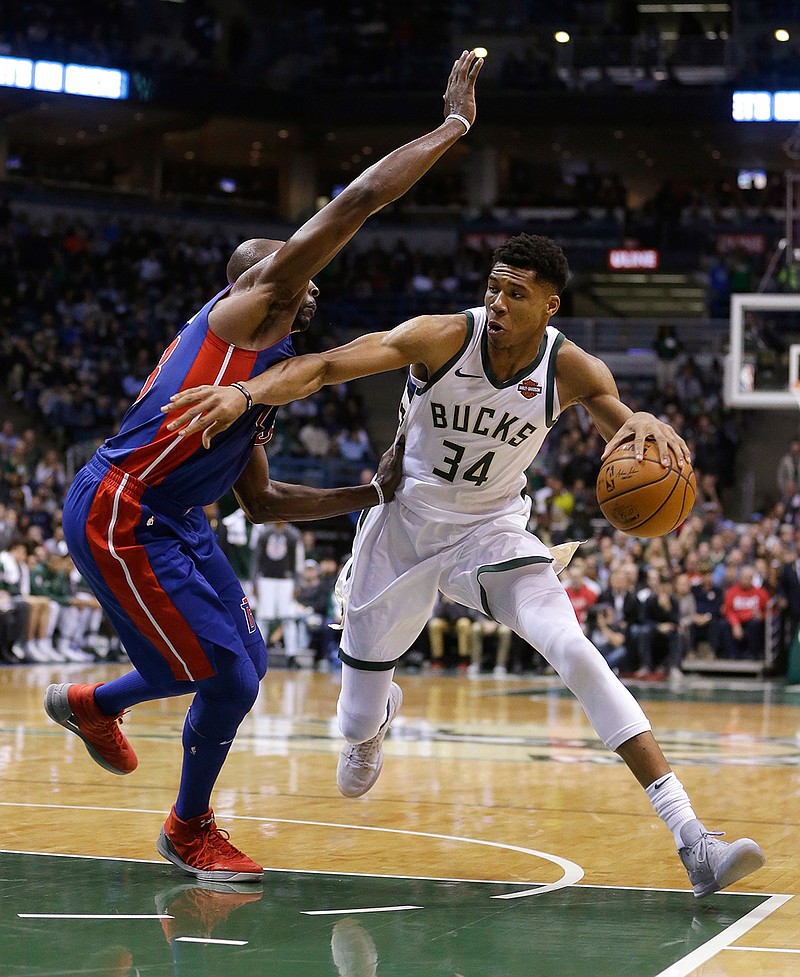 Milwaukee Bucks' Giannis Antetokounmpo (34) drives to the basket against Detroit Pistons' Anthony Tolliver during the second half of an NBA basketball game Wednesday, Nov. 15, 2017, in Milwaukee. The Bucks won 99-95. 